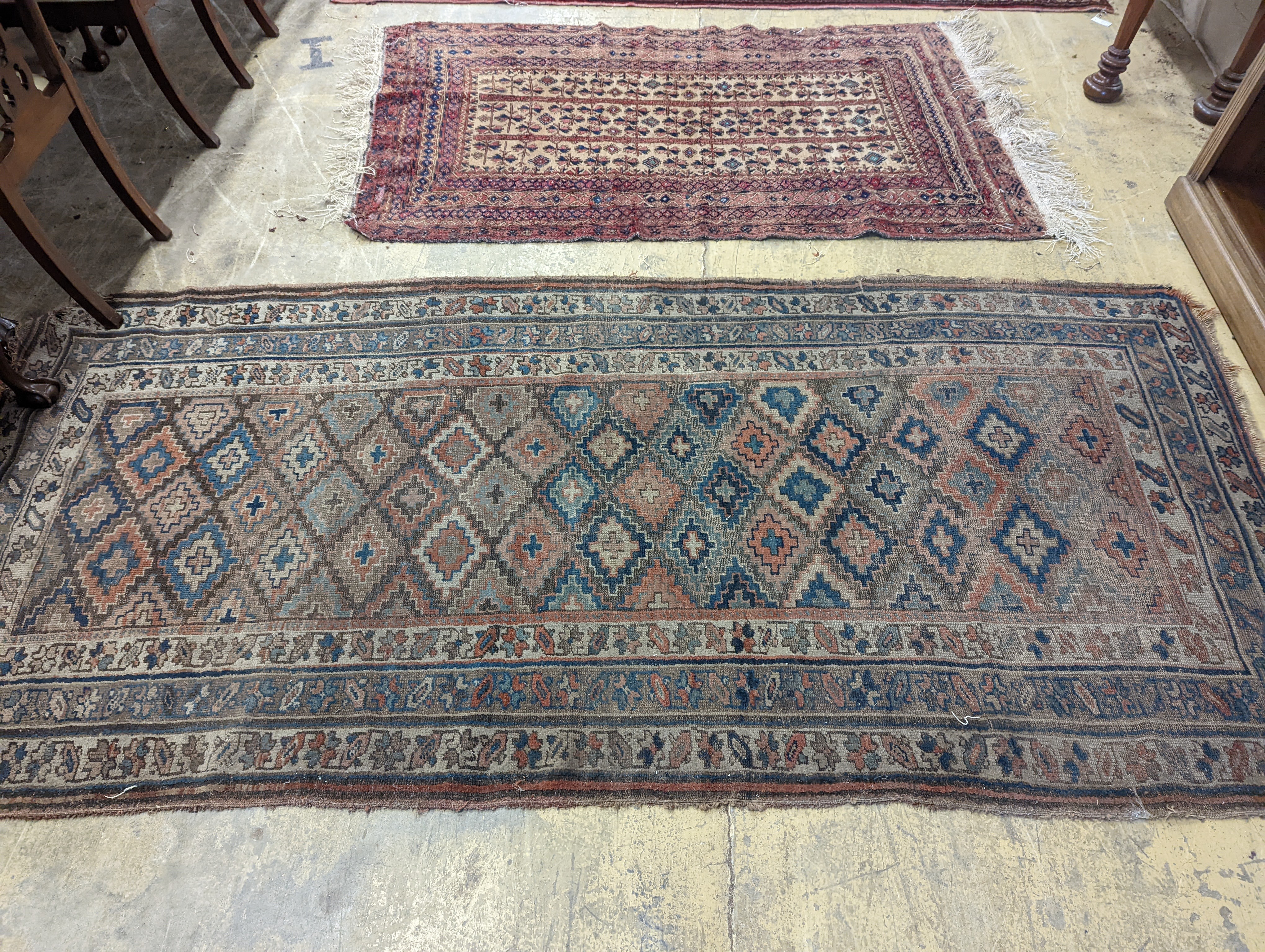 An antique Caucasian runner and a Belouch rug, larger 284 x 134cm